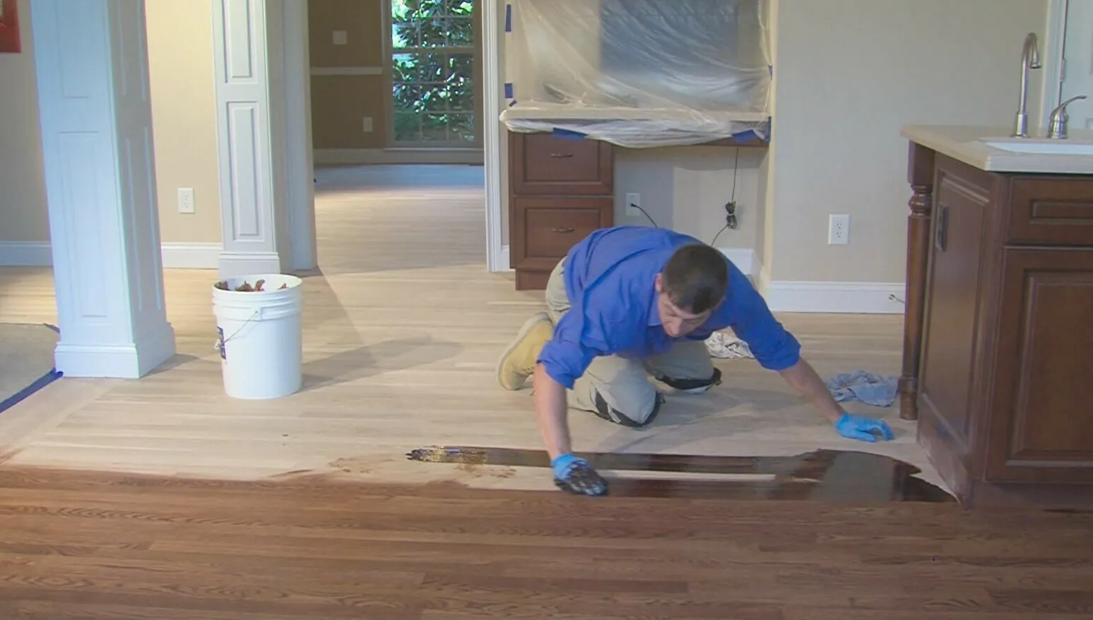 McSwain technician staining a hardwood floor
