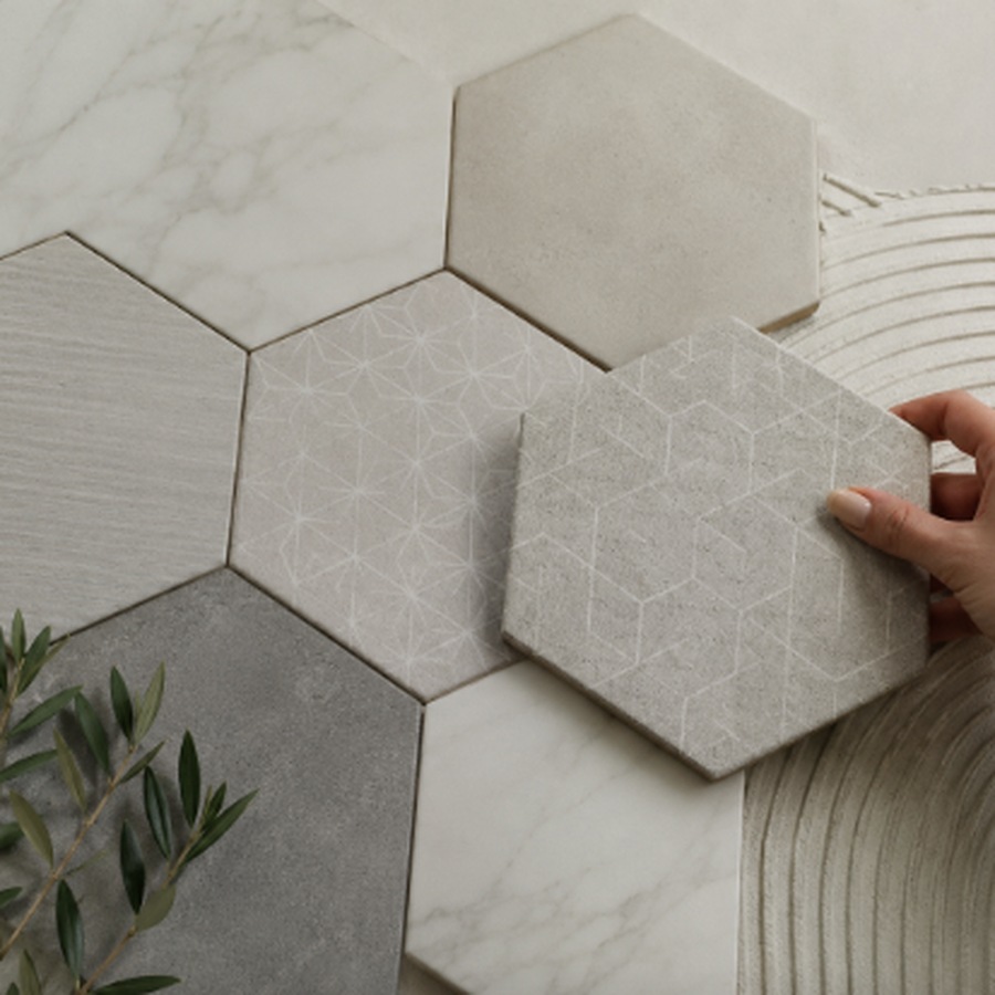 Hexagon patterned tiles being laid out before installation | McSwain Carpets & Floors