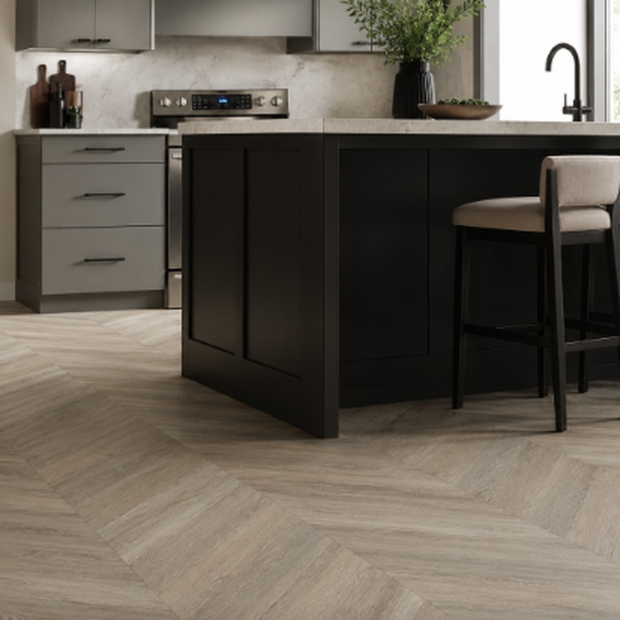 Wood-look tile flooring in a chevron pattern in a modern kitchen | McSwain Carpets & Floors