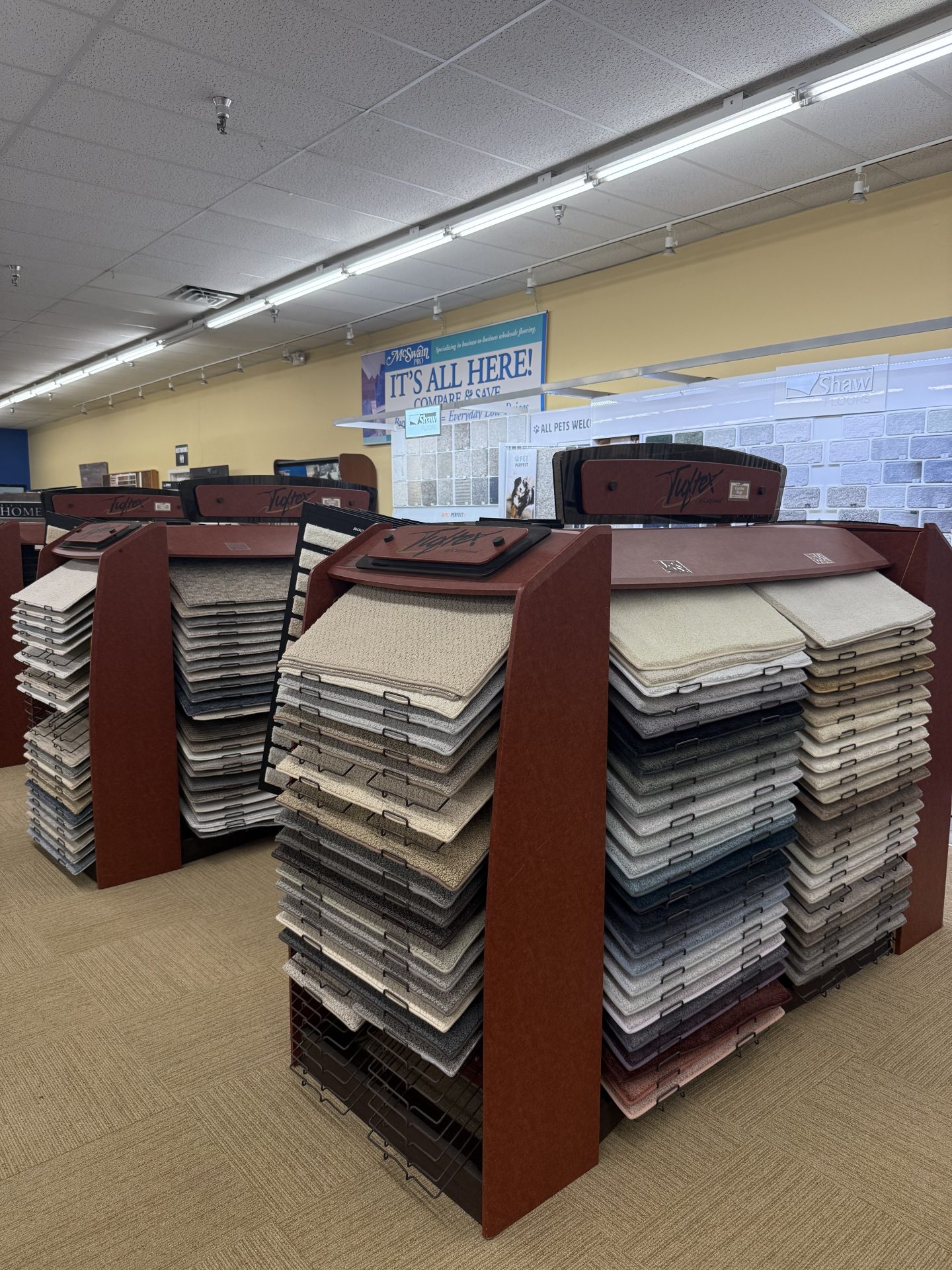 Carpet racks in the wholesale showroom | McSwain Carpets & Floors